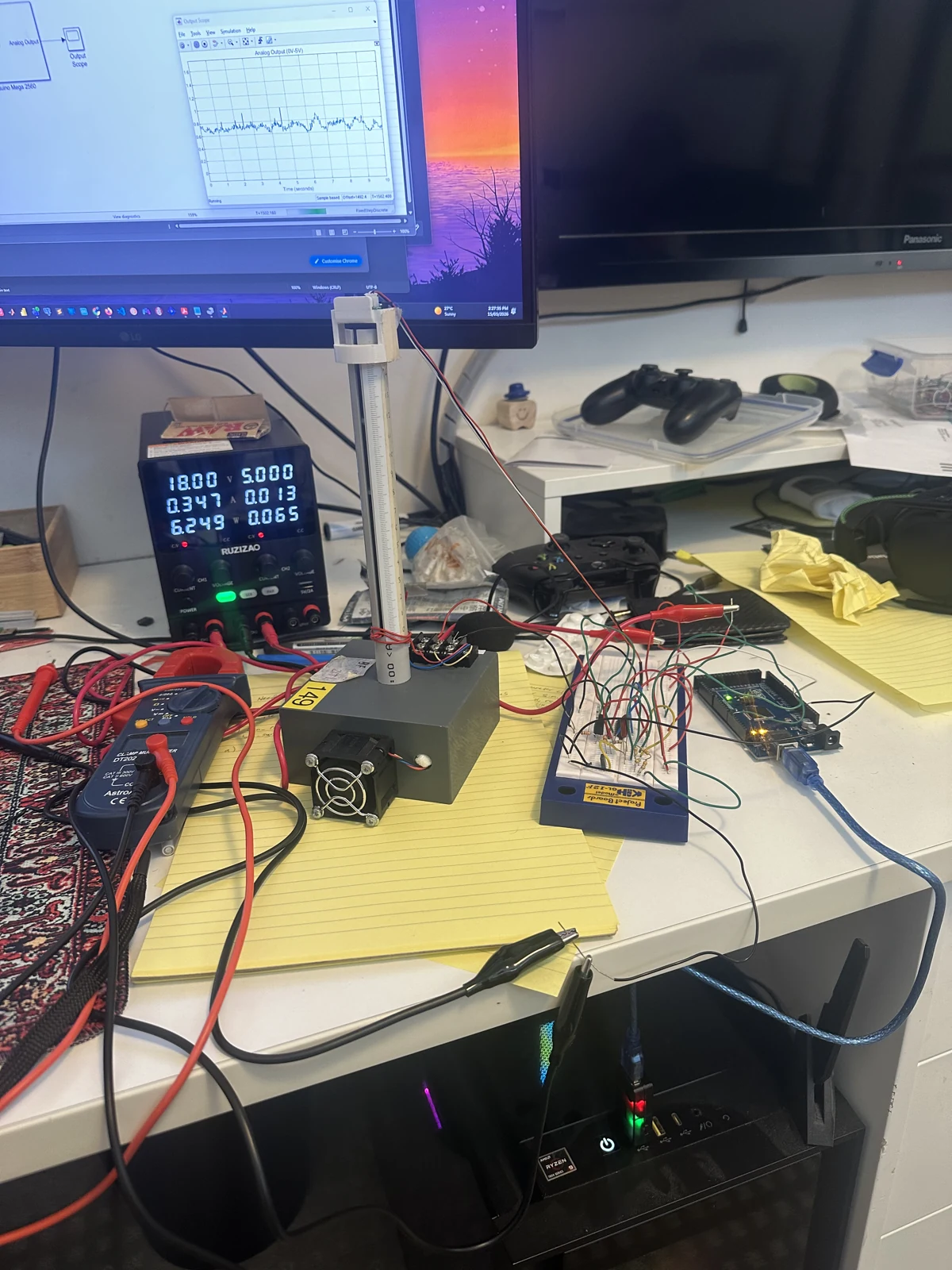 Floater tube, fan, breadboard power circuit and Arduino on an instrumented laboratory bench